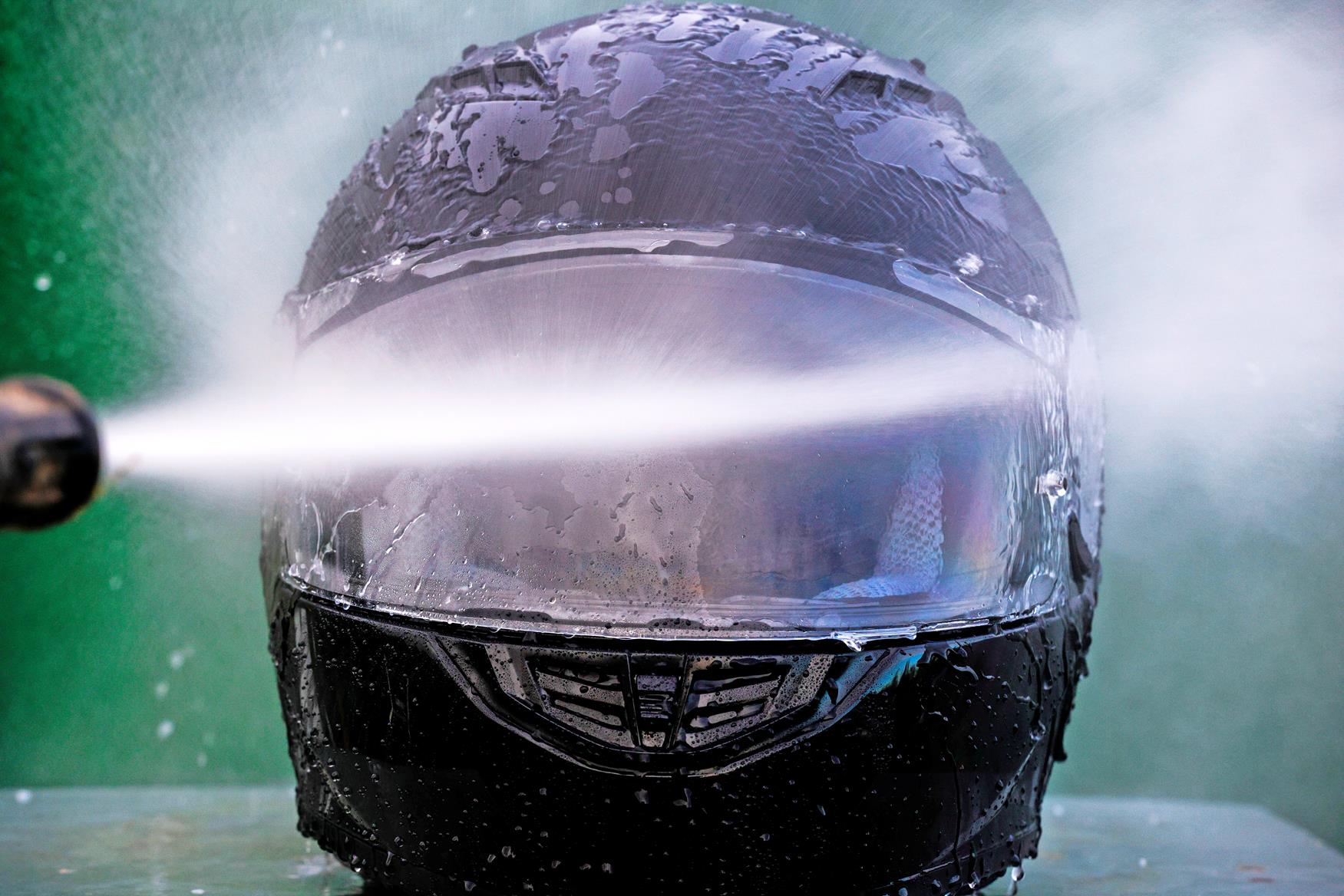 Visor being sprayed with water